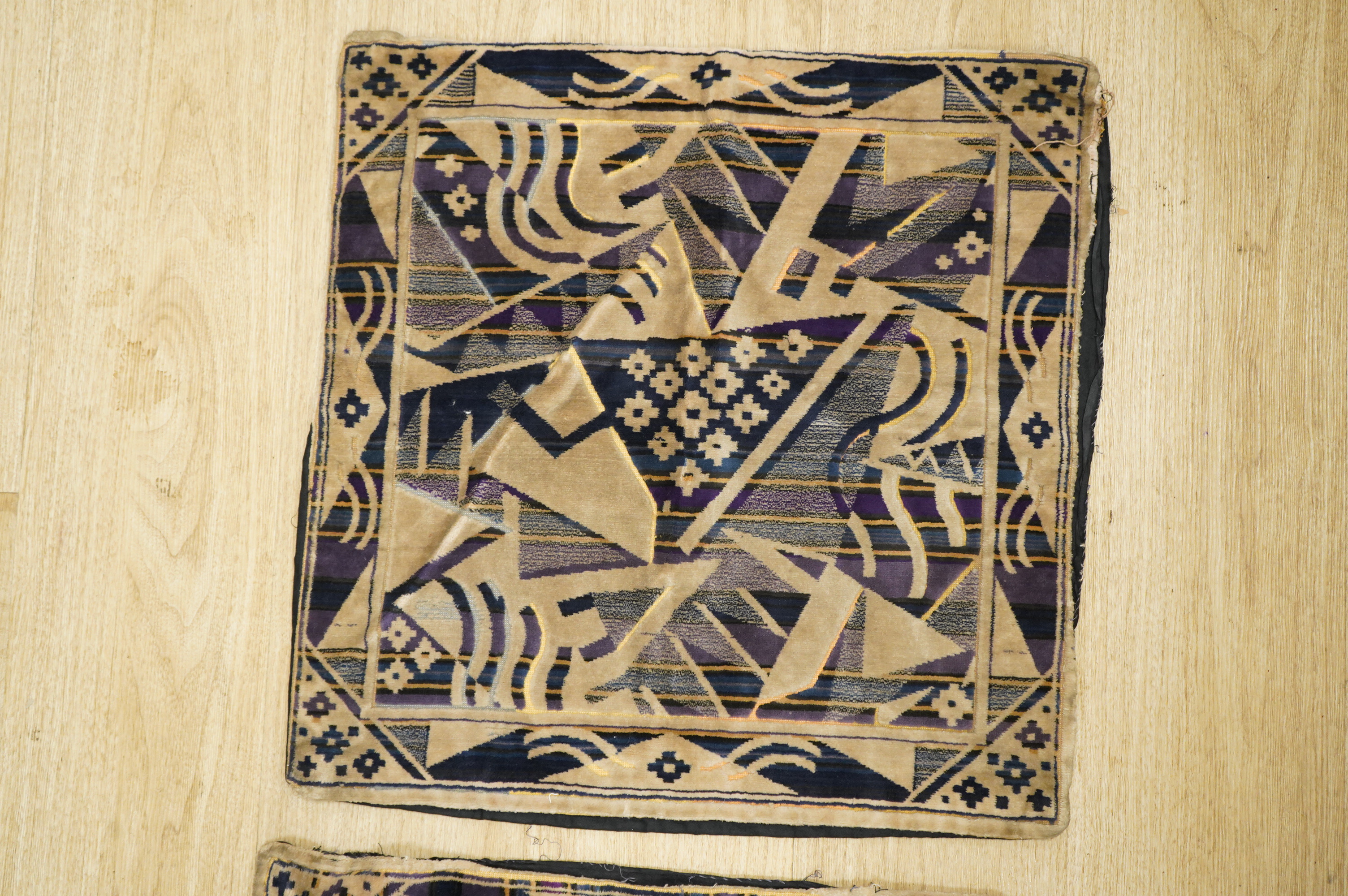 A collection of 20th century textiles to include: child's cream and gold embroidered waistcoat, a metallic embroidered bag, a leather embroidered bag, two Art Deco printed velvet cushion covers, a cotton quilted runner a